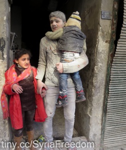 Children exit a building after an alleged air strike by Syrian government forces on the northern Syrian city of Aleppo on February 3, 2014., foto: Freedom House