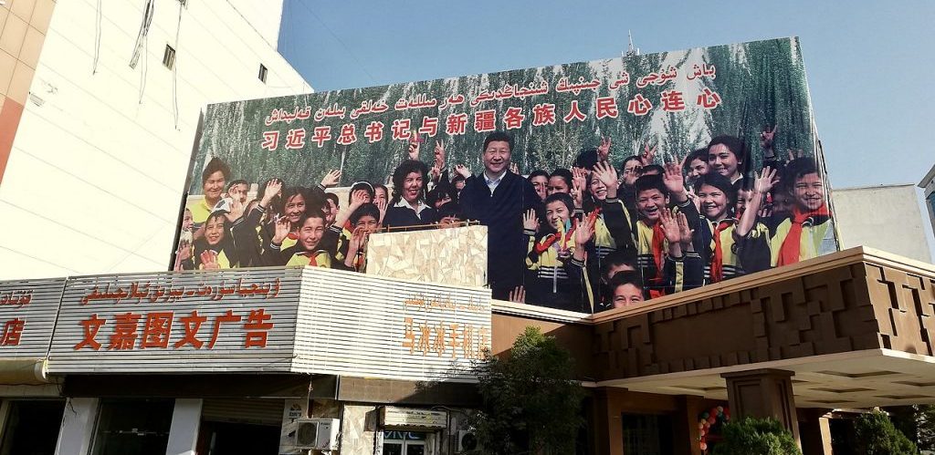 A large propaganda billboard in Kashgar Xinjiang showing Xi Jinping posing with ethnic minorities by Kubilayaxun