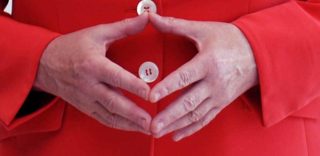 The hands of Angela Merkel forming her trademark gesture by Armin Linnartz